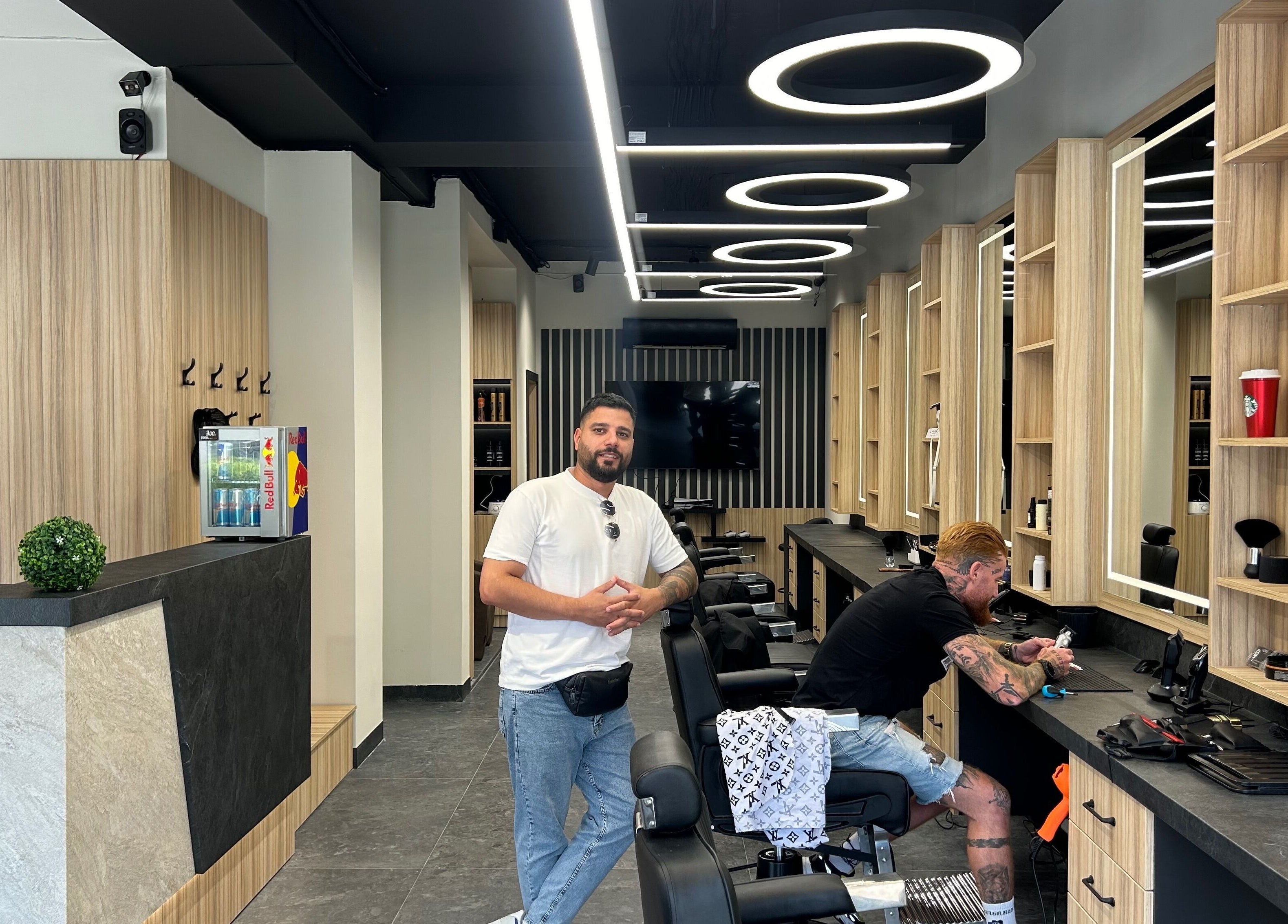 Modern interior of Galaxy barbershop in Sofia, Sofia City Province, BG with stylish decor and seating.