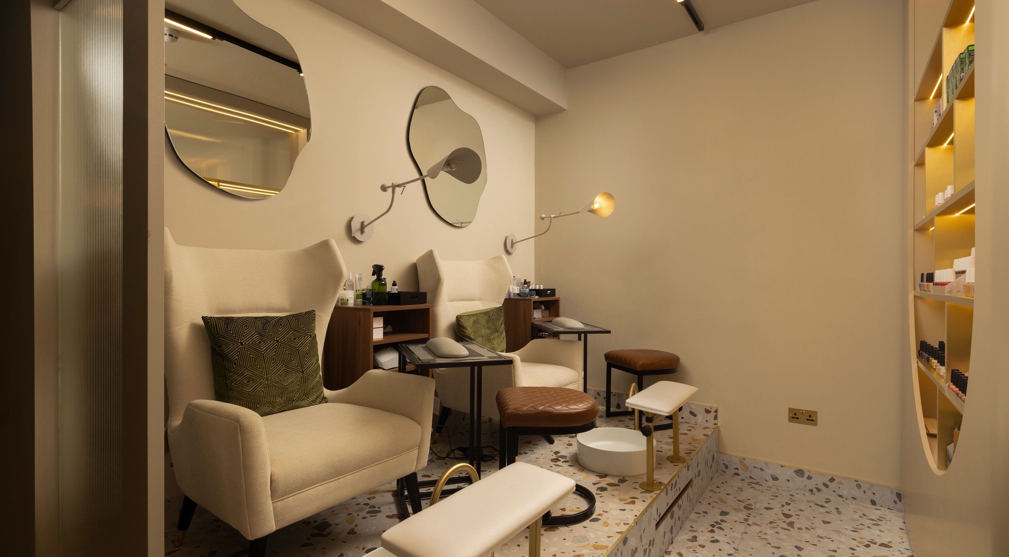 Luxurious seating at About YU, London, England, GB, in an inviting wellness setting with elegant decor.