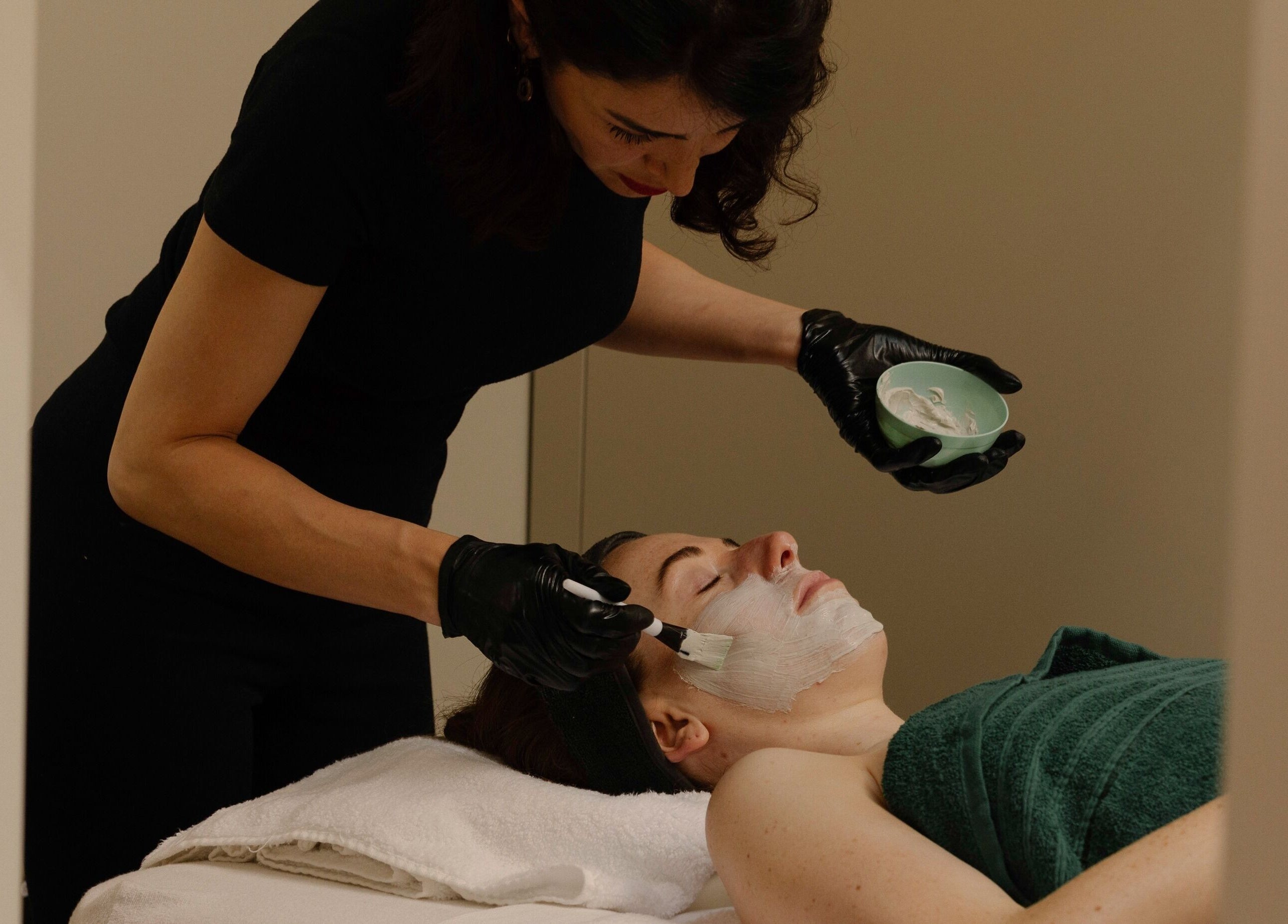 Professional facial treatment at About YU in London, England, GB, showcasing expert skincare techniques.