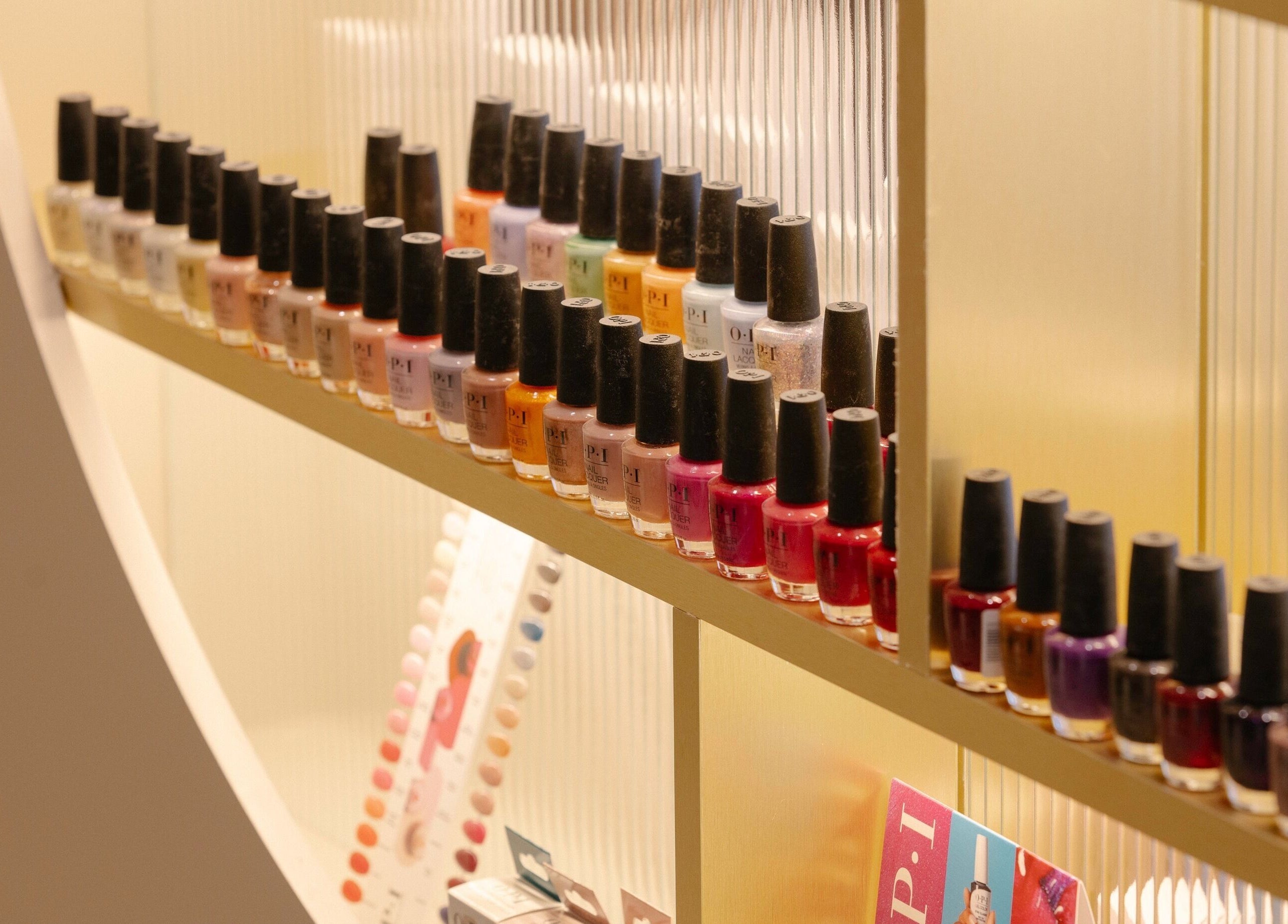 Diverse nail polish bottles neatly displayed at About YU, London, England, GB.