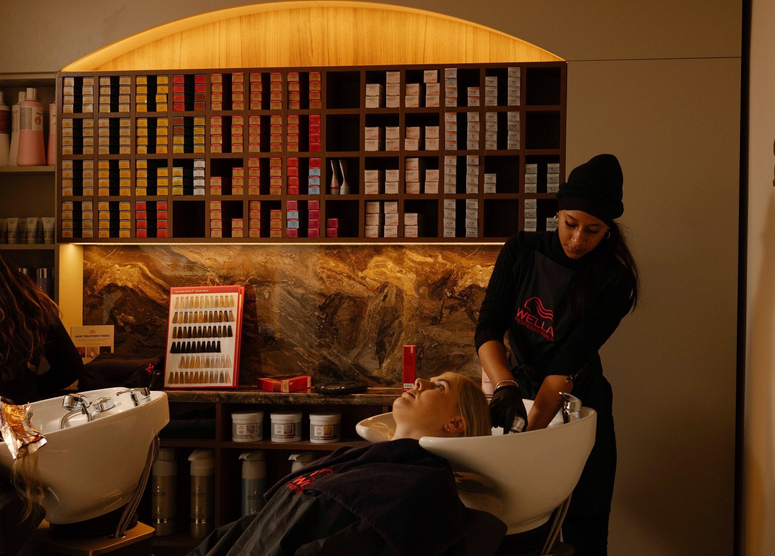 Relaxing hair wash at About YU salon in London, England, GB, showcasing luxury hair care services.