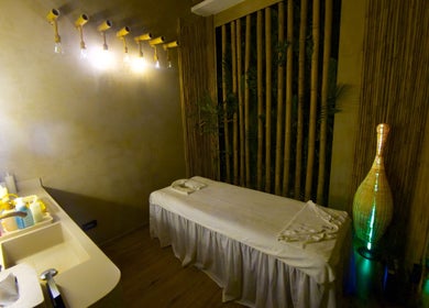 Tranquil treatment room at Pious Therapy Center L.L.C, دبي, دبي, AE, featuring bamboo decor and soft lighting.