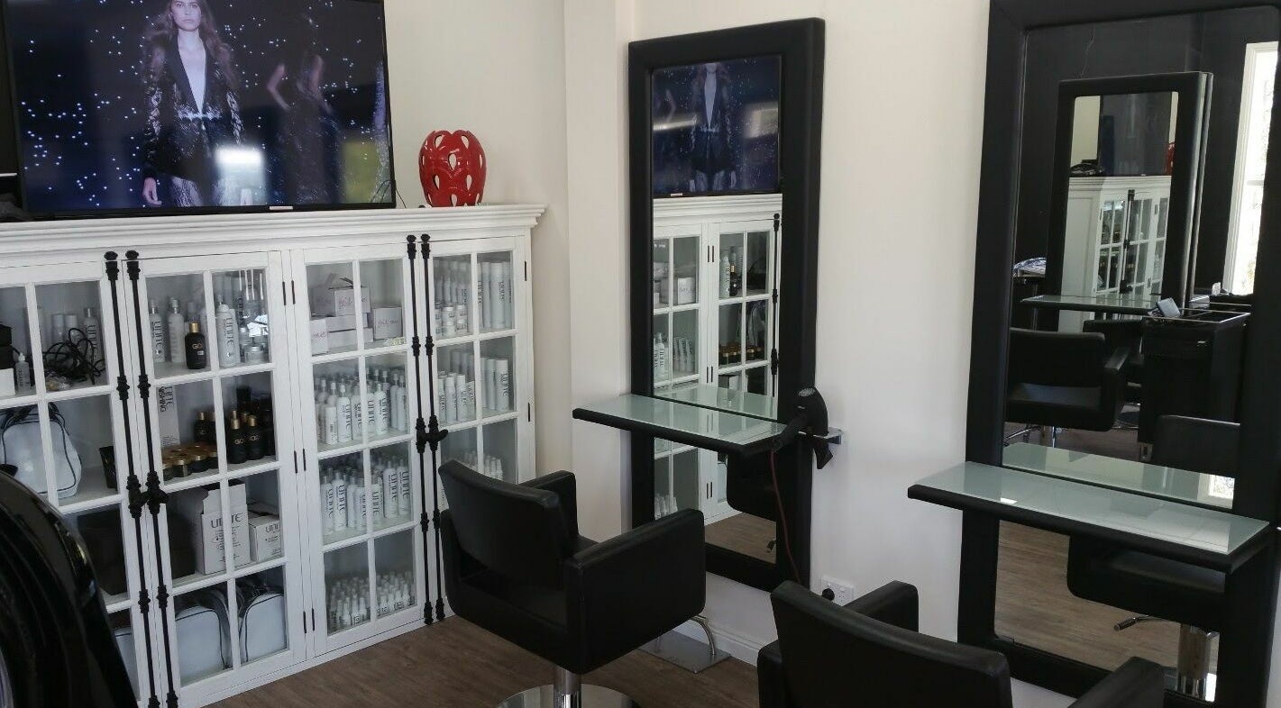 Modern styling station at Astonishing Hair, Melbourne, Victoria, AU showcasing elegance and professional products.
