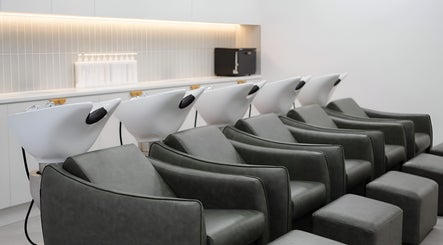 Modern wash stations at Indie Mane, Raymond Terrace, New South Wales, AU showcasing sleek salon design.