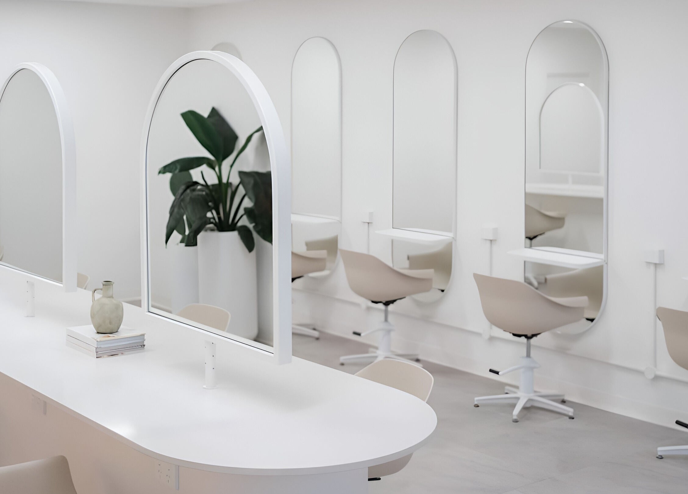 Chic salon interior at Indie Mane, Raymond Terrace, NSW. Minimalist mirrors and styling stations in a sleek setting.