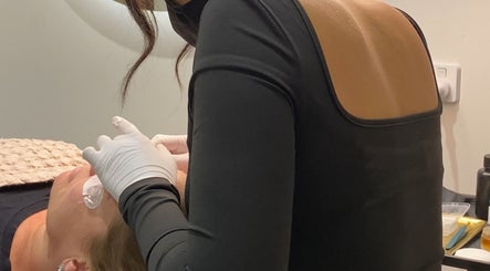 Beauty professional treating client at Amanda Burke Beauty, Melbourne, Victoria, AU.