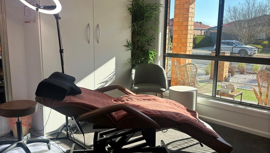 Cozy treatment room at MKL Beauty in Gungahlin, Australian Capital Territory, AU, with a plush chair and modern decor.