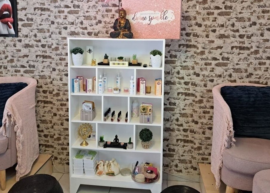 Relaxing lounge area at Divine Sparkle, Randburg, Gauteng, ZA with plush chairs and product display.