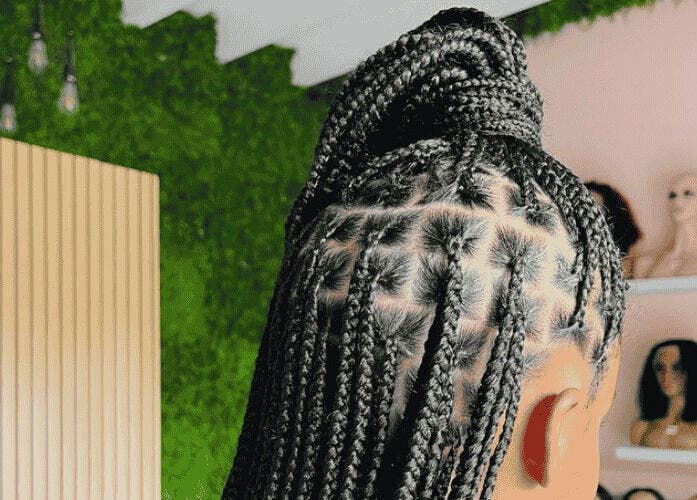 Intricate braided hairstyle at Glam Bar21, Howick, Kwazulu-natal, ZA, showcases expert styling.