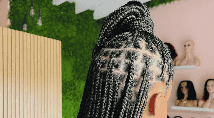 Intricate braided hairstyle at Glam Bar21, Howick, Kwazulu-natal, ZA, showcases expert styling.