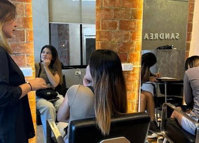 Professionals at Sandrea Salon Parañaque discussing styles in Parañaque, Metro Manila, PH.