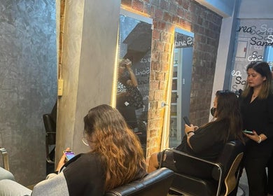 Clients enjoy styling at Sandrea Salon Parañaque, located in Parañaque, Metro Manila, PH. Warm, inviting ambiance.
