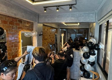 Stylish interior of Sandrea Salon Parañaque with clients engaged in activities. Located in Parañaque, Metro Manila, PH.