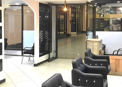 Modern salon interior at Elora Hair & Beauty Studio in Nairobi, Nairobi County, KE. Comfortable seating and stylish decor.