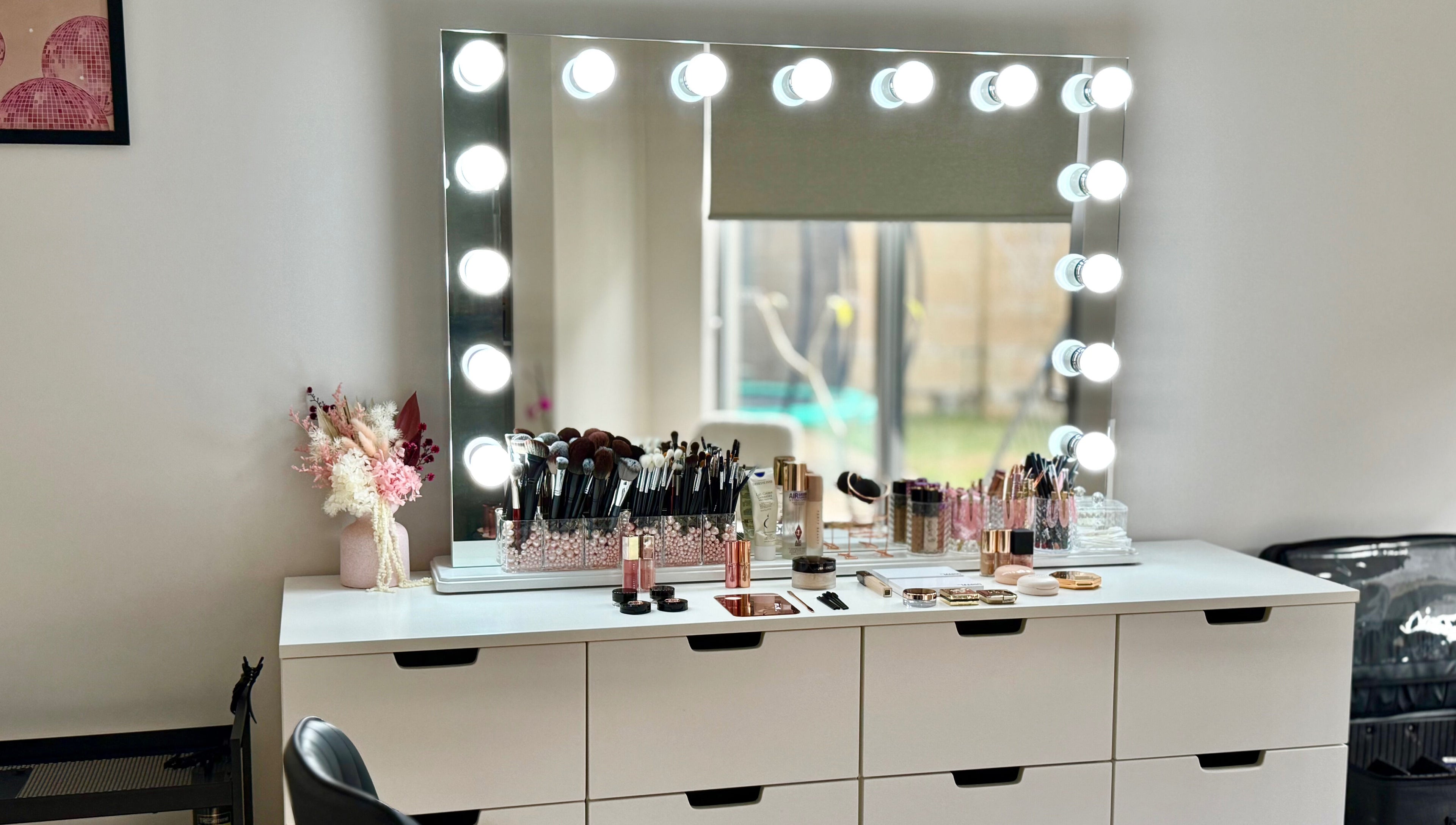 Makeup vanity at Kateryna Glowmakeup in Yokine, Western Australia, AU, featuring cosmetics and bright lights.
