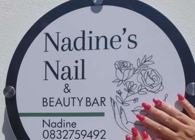 Nadine's Nail & Beauty Bar sign at Techno Park, Stellenbosch, Western Cape, ZA with hand displaying elegant nails.