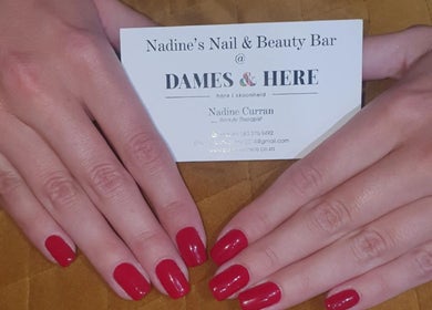Showcasing manicured red nails at Nadine's Nail & Beauty Bar Techno Park Stellenbosch, Western Cape, ZA.