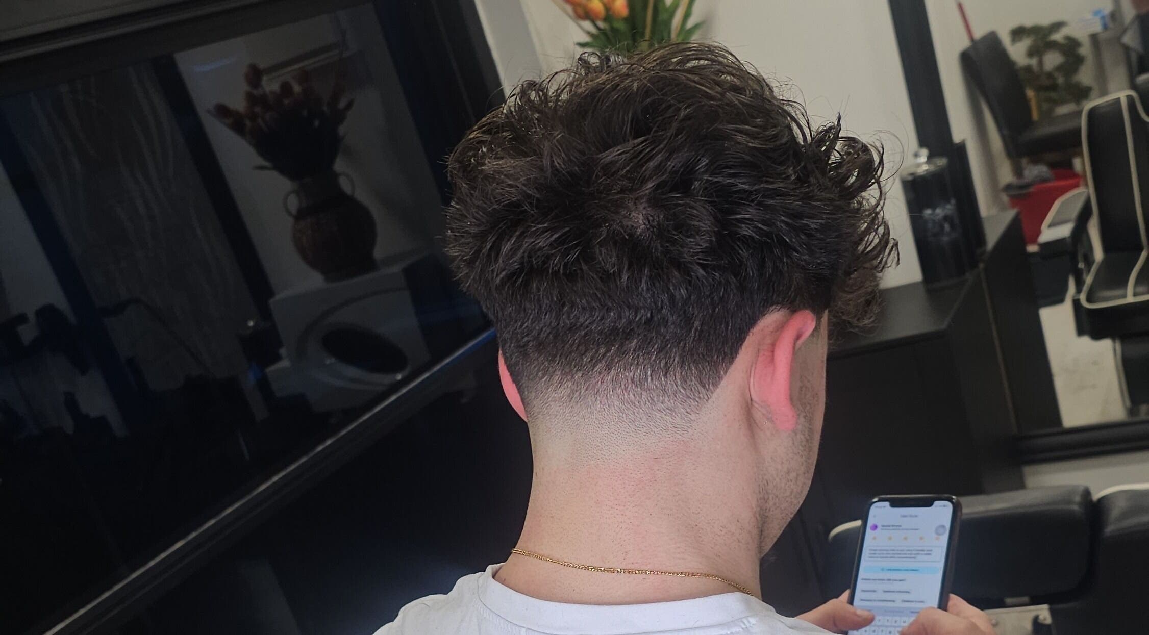 Stylish haircut at Sabi Style salon in Edgware, England, GB showcasing modern hair trends.