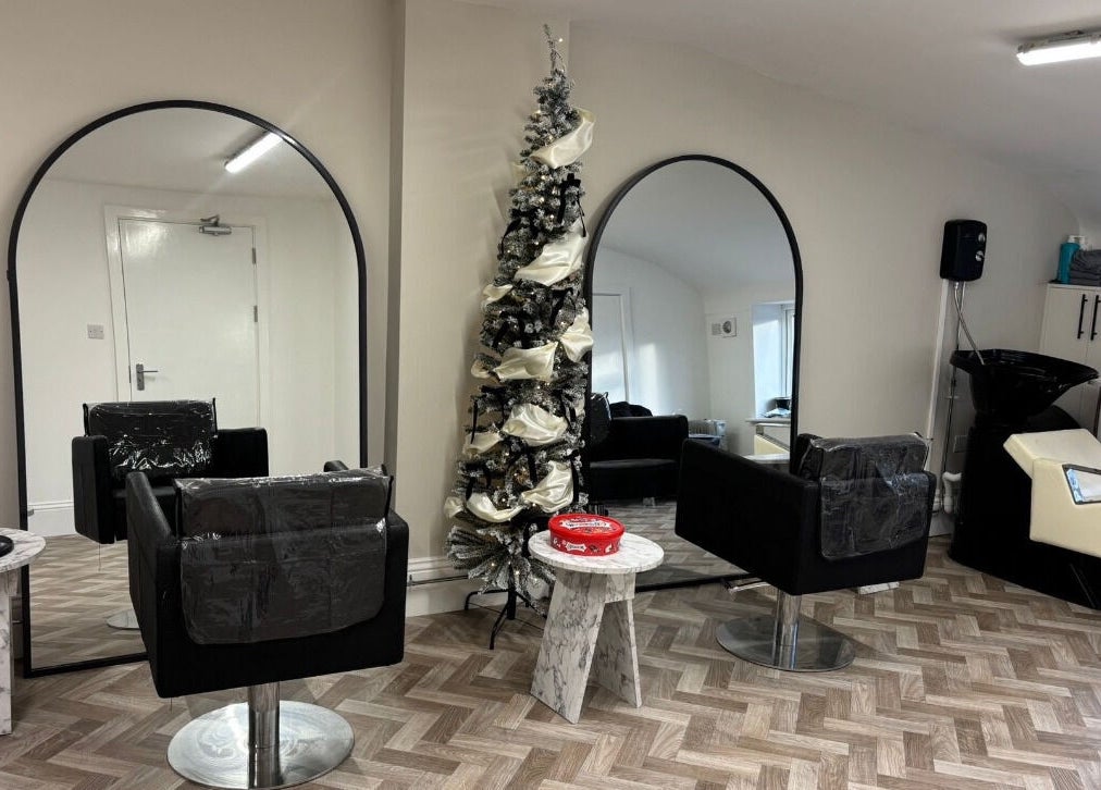 Elegant salon interior at Beauty by Casey, Birkenhead, England, GB. Features stylish mirrors and seating.