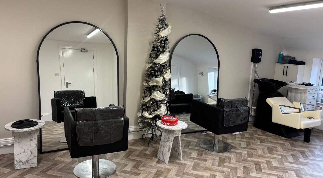 Elegant salon interior at Beauty by Casey, Birkenhead, England, GB. Features stylish mirrors and seating.