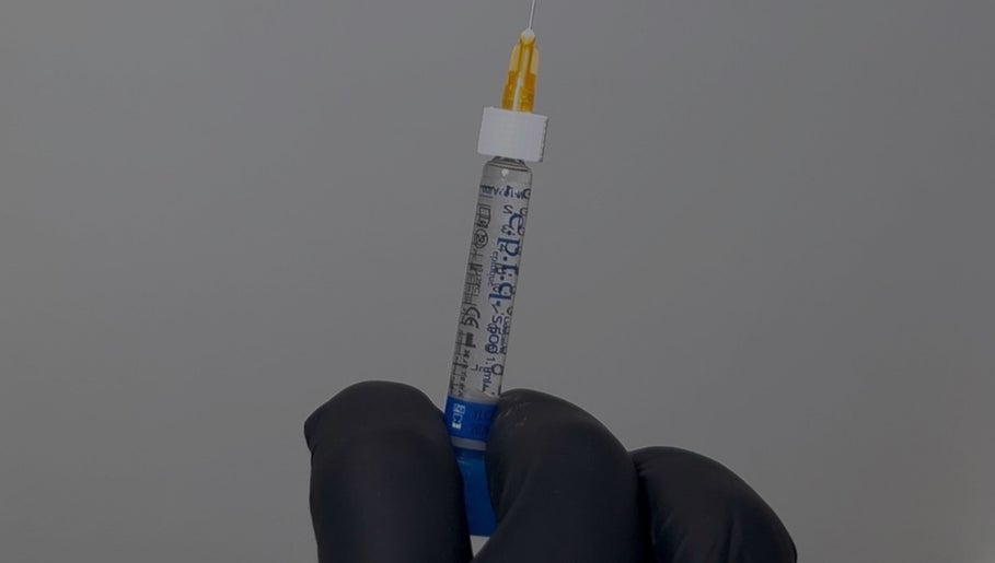 Professional injection preparation at AESTHETICS. By Nurse Ryan, Glasgow, Scotland, GB, showcasing precision care.