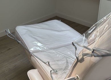 Comfortable treatment chair at AESTHETICS. By Nurse Ryan, Glasgow, Scotland, GB, ensuring client relaxation.