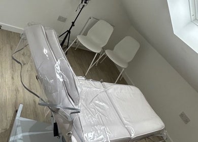 Treatment room at AESTHETICS. By Nurse Ryan, Glasgow, Scotland, GB with modern design and serene ambiance.