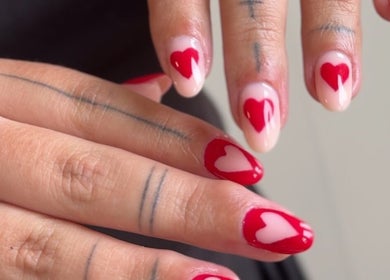 Red heart nail art at Nails by Krisztina in Saint Helens, England, GB showcasing stunning craftsmanship.