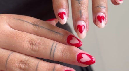 Red heart nail art at Nails by Krisztina in Saint Helens, England, GB showcasing stunning craftsmanship.