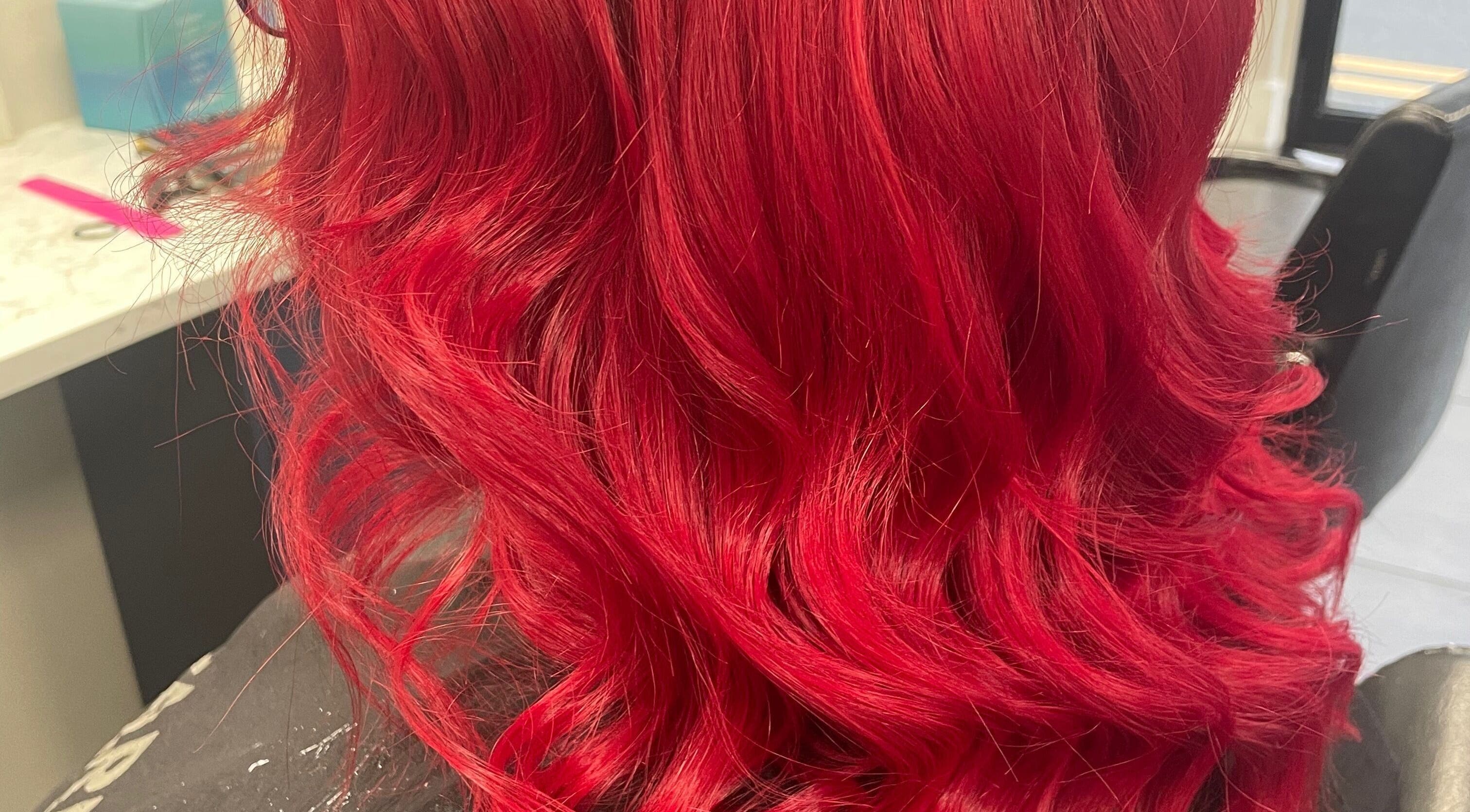 Bright red wavy hair styled at Bella & Co. in Newtownards, Northern Ireland, GB.