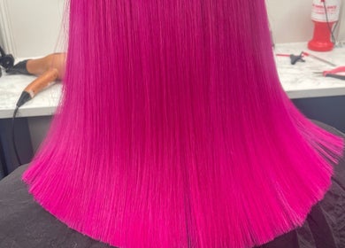 Vibrant magenta hair styled at Bella & Co. in Newtownards, Northern Ireland, GB, showcasing expert coloring.