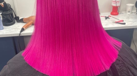 Vibrant magenta hair styled at Bella & Co. in Newtownards, Northern Ireland, GB, showcasing expert coloring.