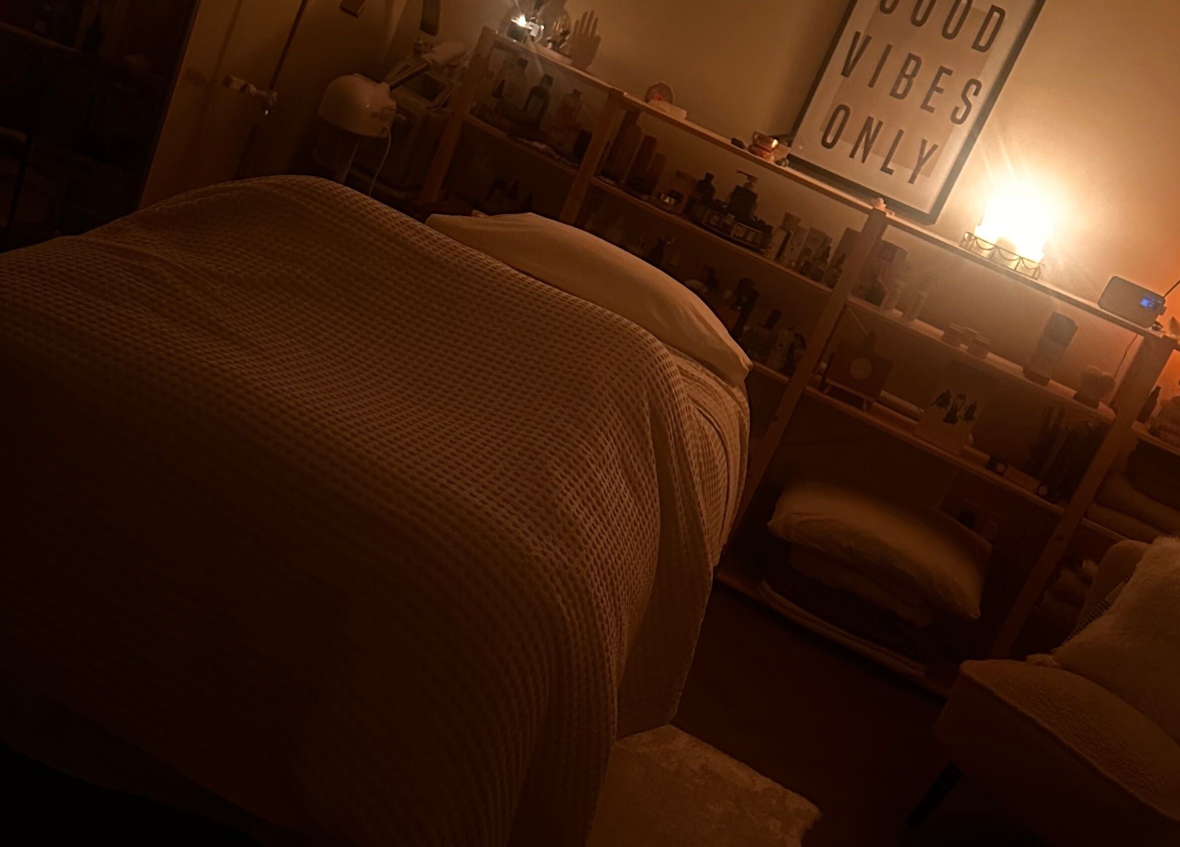 Warm treatment room at Soul Skin Studio and Wellness, Blantyre, GB, with ambient lighting and cozy decor.