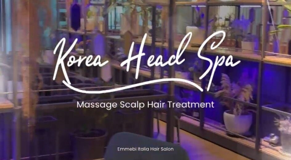 Korea Head Spa TTDI by Emmebi Hair Salon entrance in Kuala Lumpur, featuring elegant plant decor and ambient lighting.