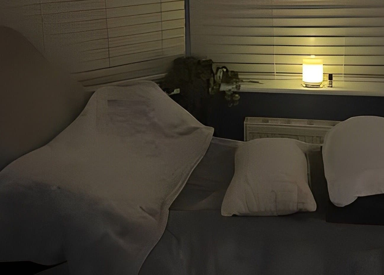 Relaxing therapy room at Inner Balance Clinical Reflexology in Methley, England, GB, with dim lighting and a massage bed.