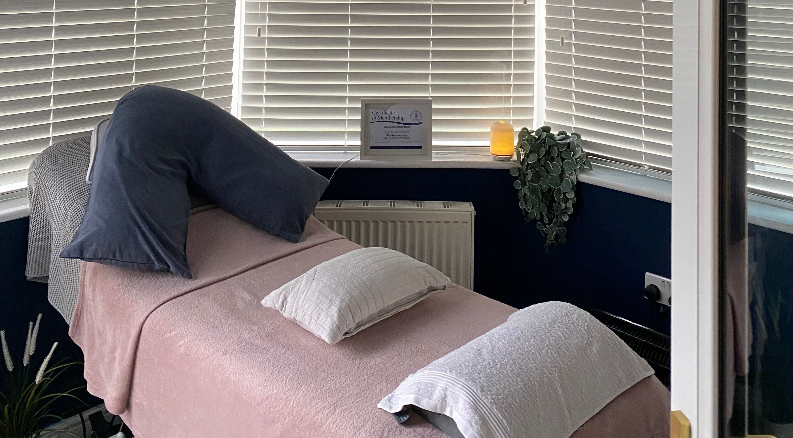 Cozy treatment room at Inner Balance Clinical Reflexology, Methley, England, GB, with a softly lit ambiance.