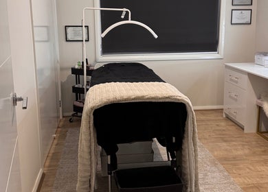 Elegant treatment room at Victoria Makeup Artistry, Mickleham, Victoria, AU, featuring a cozy massage table.