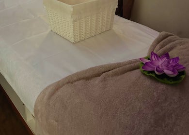 Massage table with towel and flower at Shellharbour Village Thai Massage in Shellharbour, New South Wales, AU.