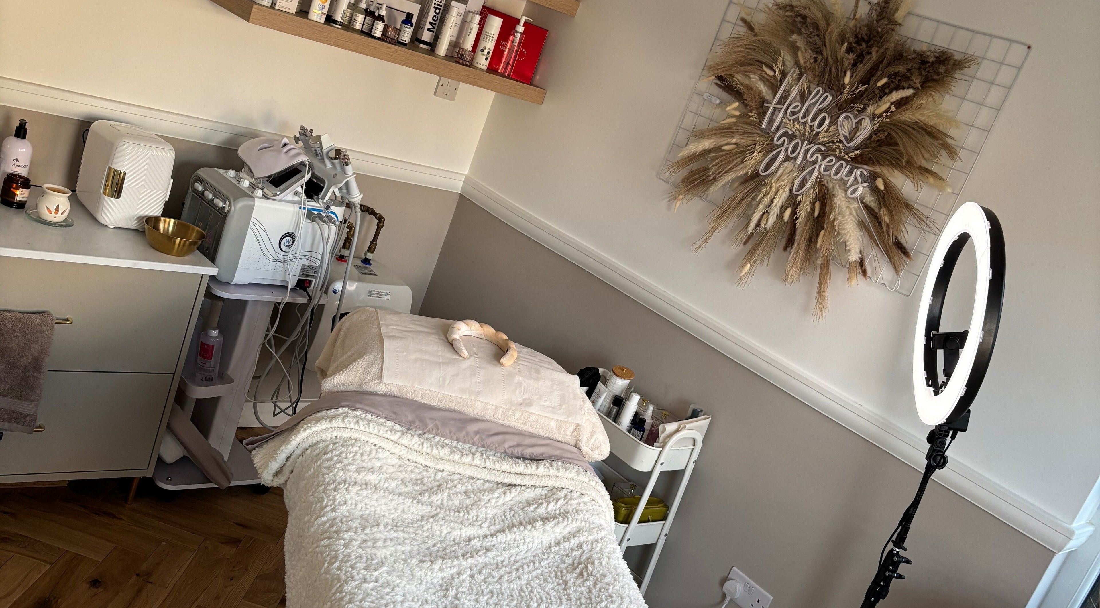 Chic beauty room at Avajó Skin, Sheffield, England, GB with treatment bed and elegant decor.