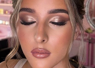Elegant makeup look by Makeup by Meg Stoke, showcasing shimmering eyes and glossy lips in Stoke-on-Trent, England, GB.