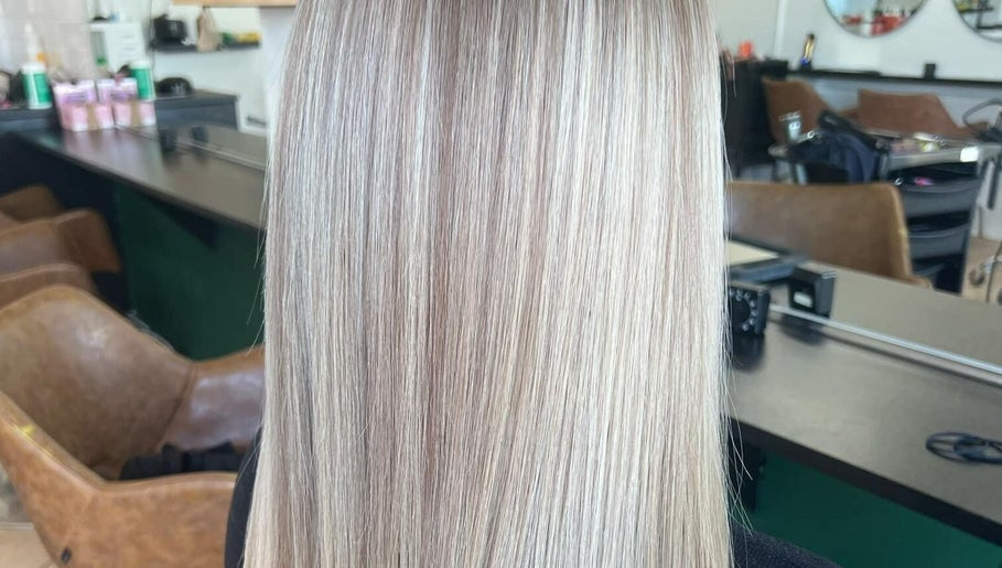 Smooth blonde hair at CORR Hair Artistry, Edgeworth, New South Wales, AU showcasing professional salon styling.