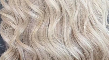 Blonde wavy hair styled at CORR Hair Artistry in Edgeworth, New South Wales, AU.