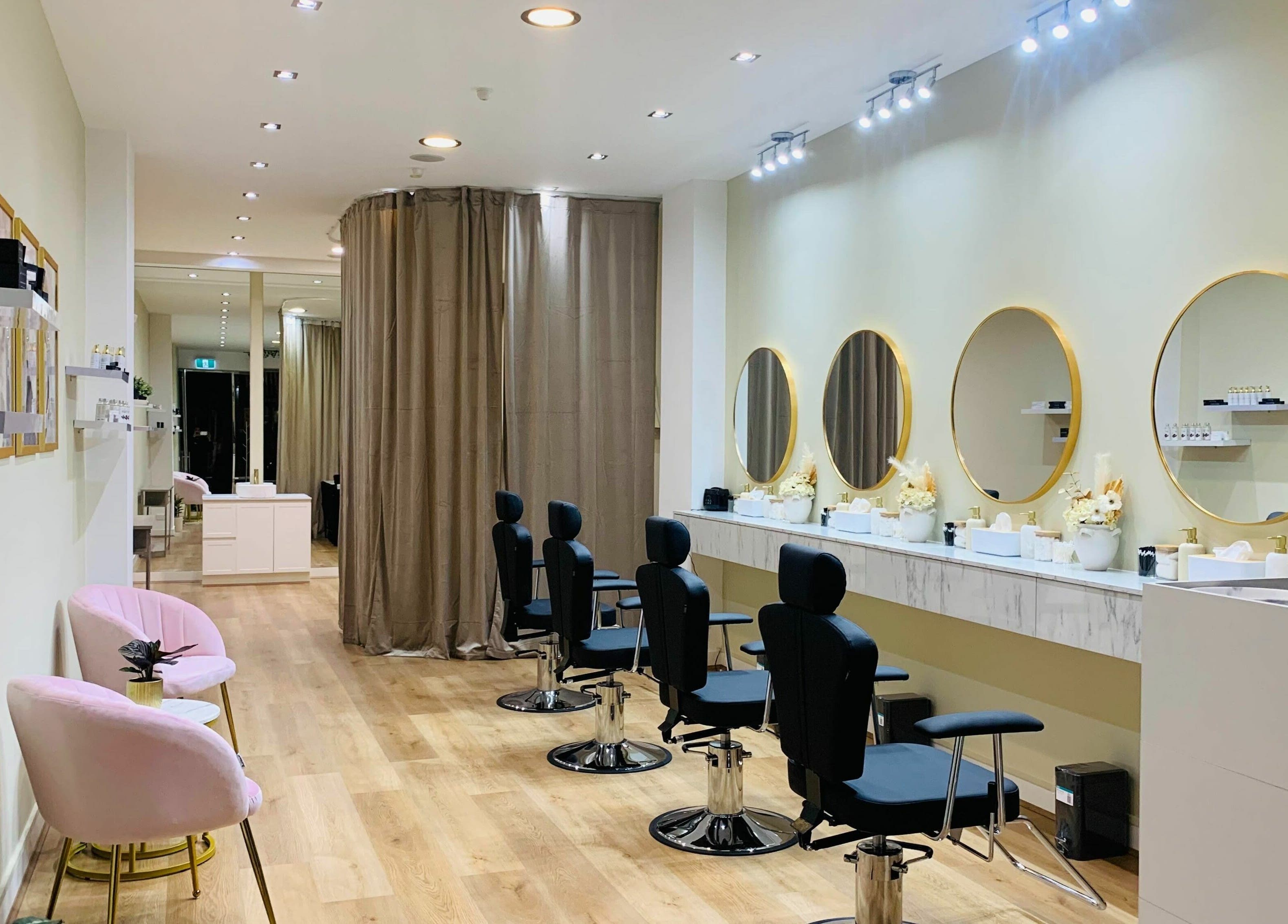 Elegant interior of Fleek Brows in Prahran, Victoria, AU, featuring sleek styling stations and modern decor.