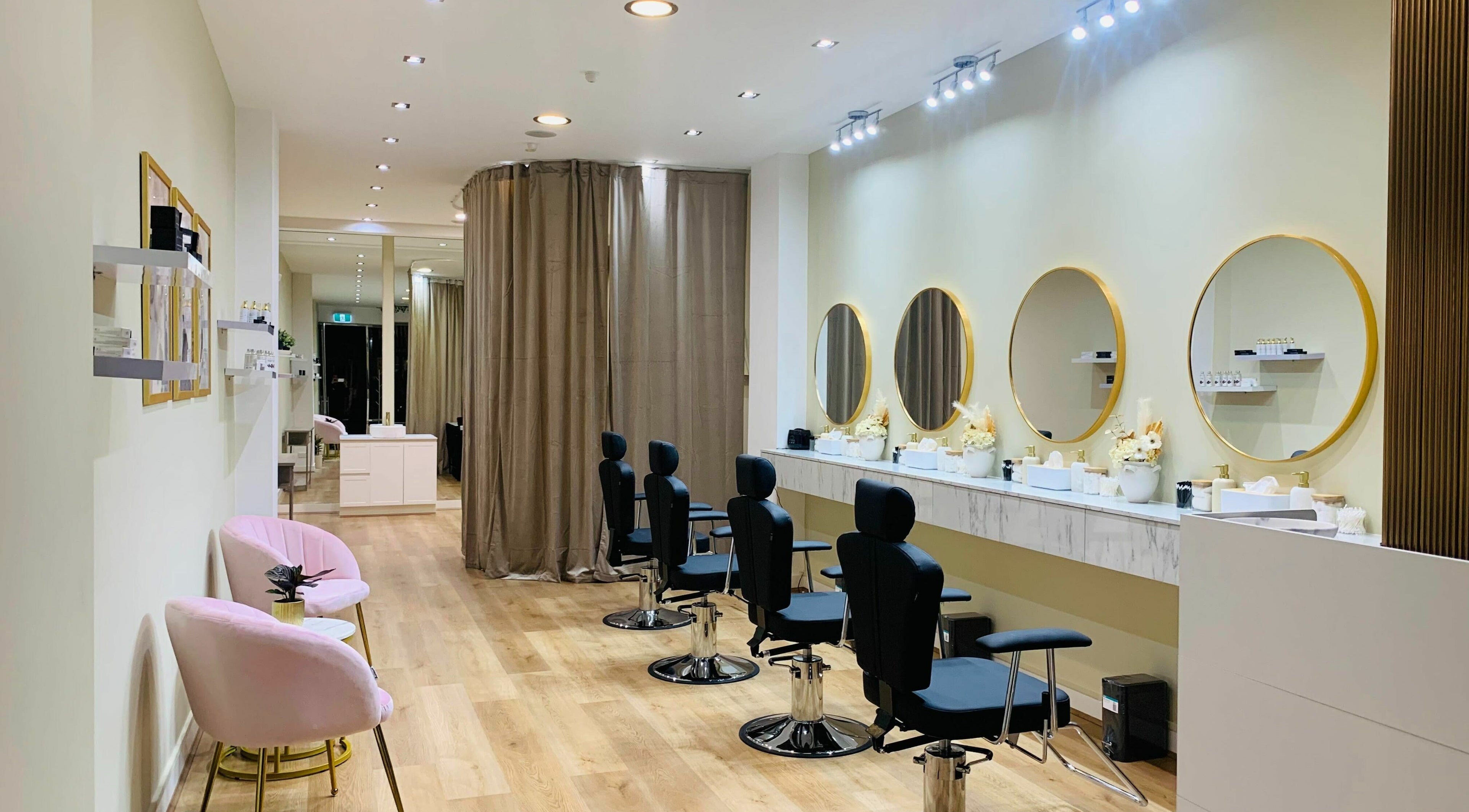 Elegant interior of Fleek Brows in Prahran, Victoria, AU, featuring sleek styling stations and modern decor.
