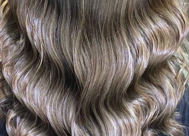 Elegant wavy hairstyle at Silver Hair - Al Khobar, Eastern Province, SA. Perfect finish and shine.