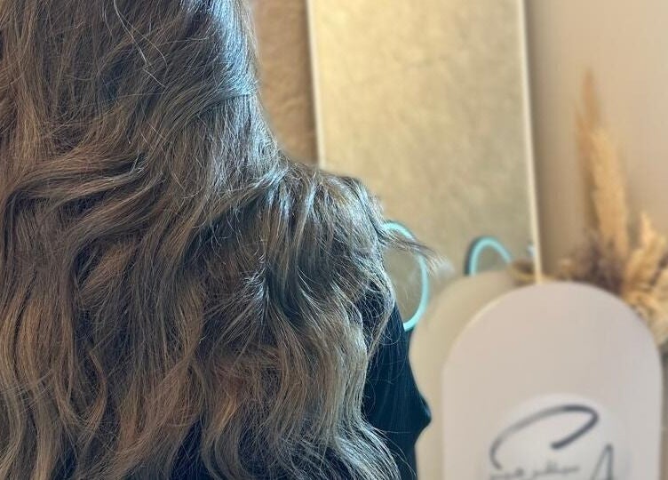 Elegant wavy hairstyle reflected in a mirror at Silver Hair - Al Qirwan, Riyadh, Riyadh Province, SA.