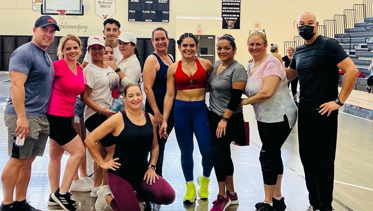 Group fitness session at Grey’s Total Training, Miami, Florida, US, showcasing energetic participants.