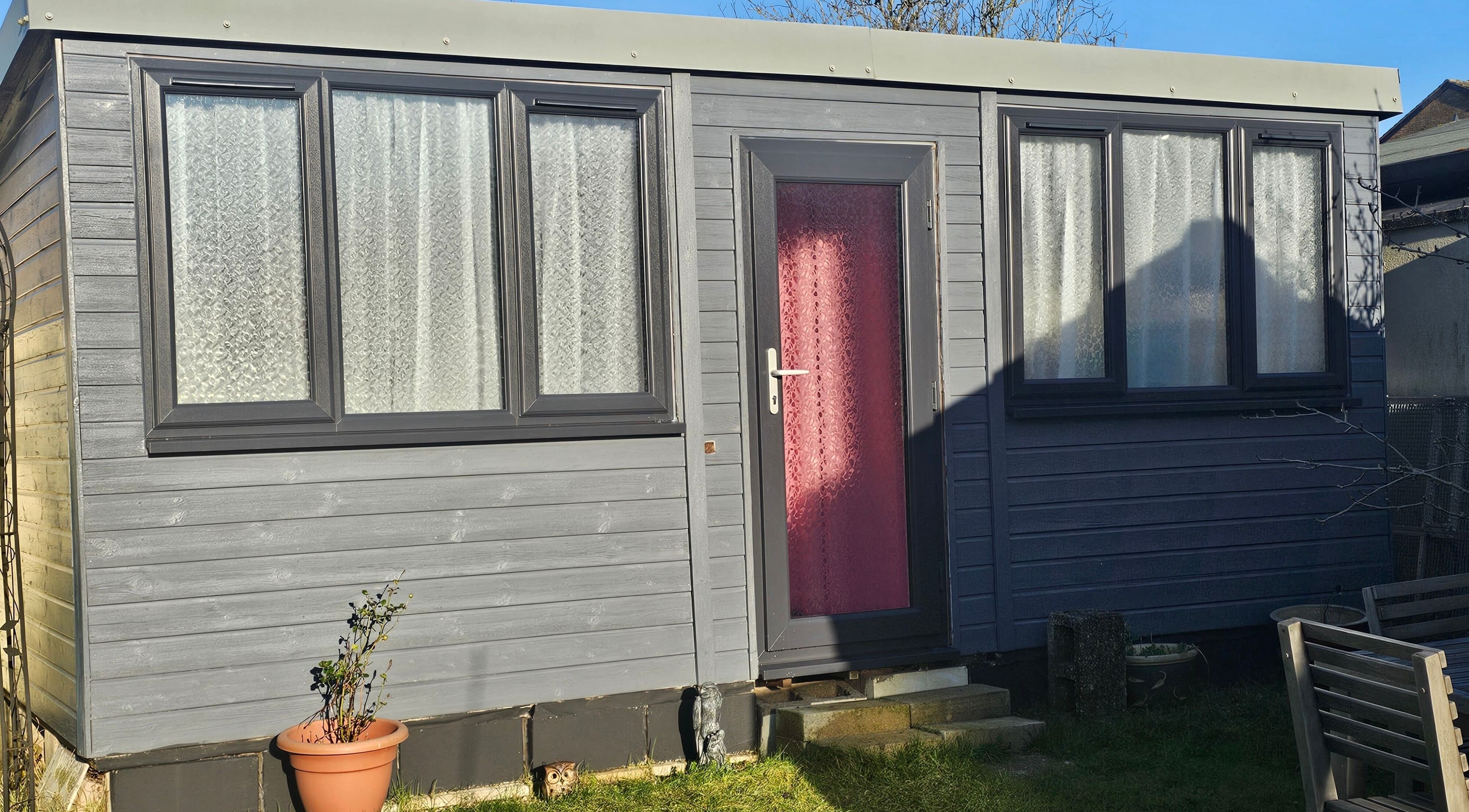Cozy grey studio cabin at Bella Tu, Haverhill, England, GB, showcasing comfortable exterior design.