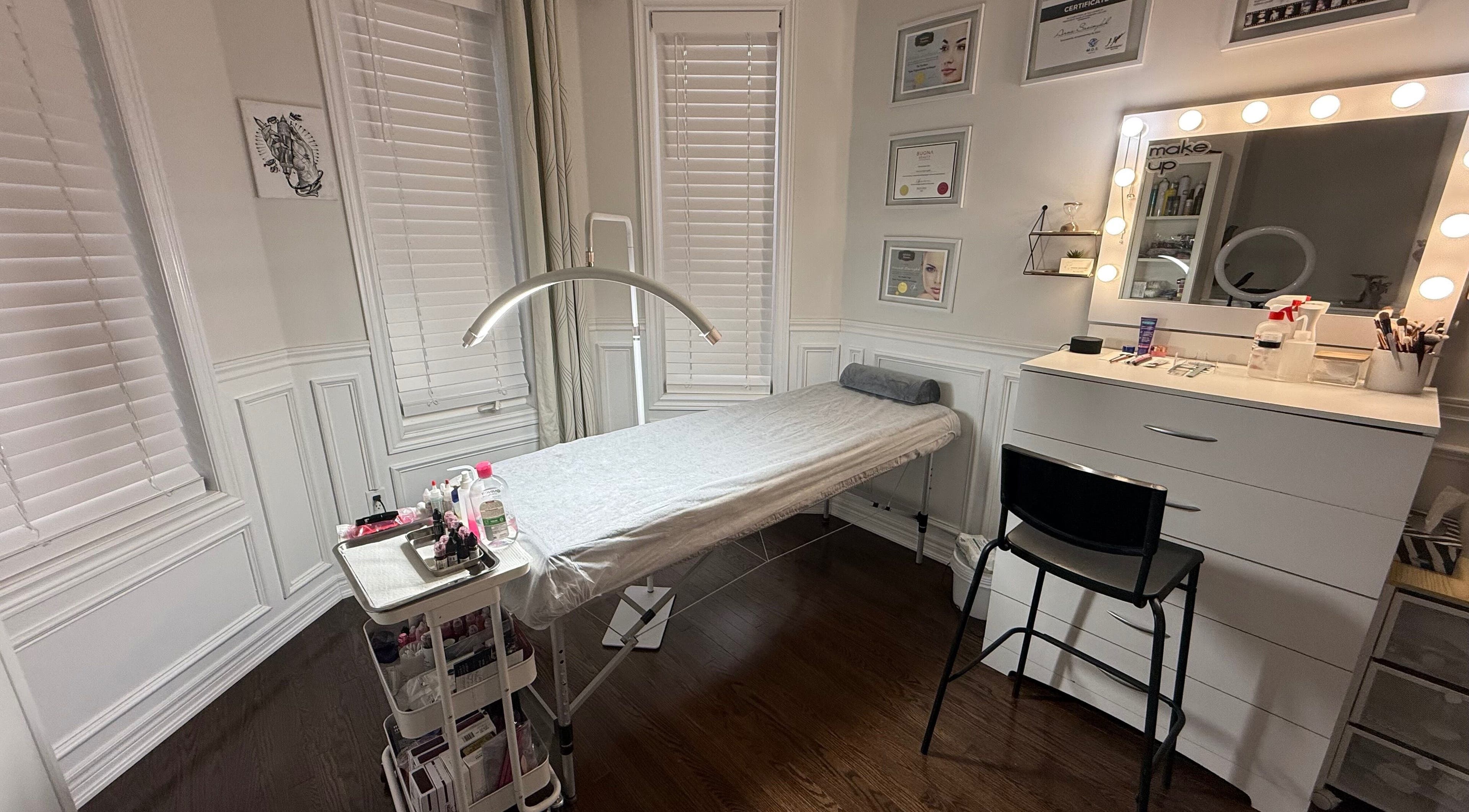 Cozy treatment room at Hanna Savinykh Beauty Studio in Markham, Ontario, CA, featuring a massage table and beauty products.