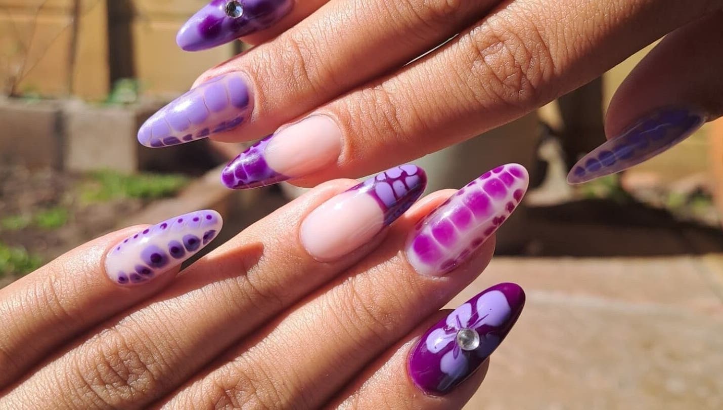 Elegant purple nail art design at Nailed by Chels in Cape Town, Western Cape, ZA, showcasing creativity and style.